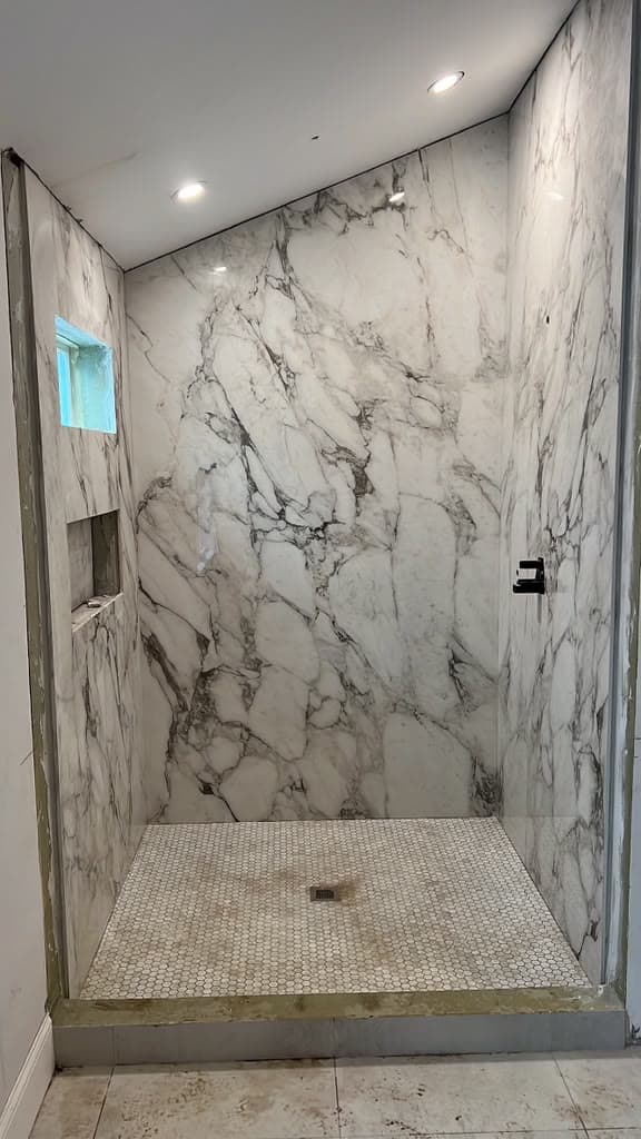 Book-matched marble shower surround