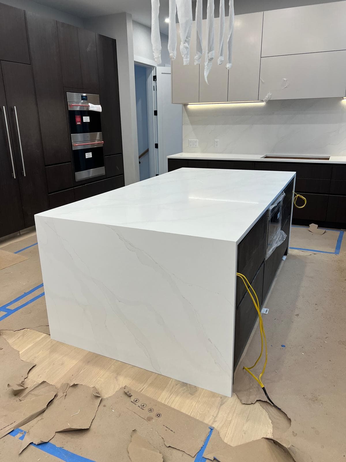 White quartzite island, contemporary kitchen